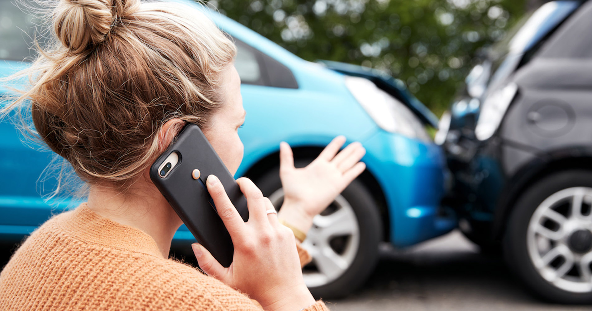 Woman on her cellphone after accident