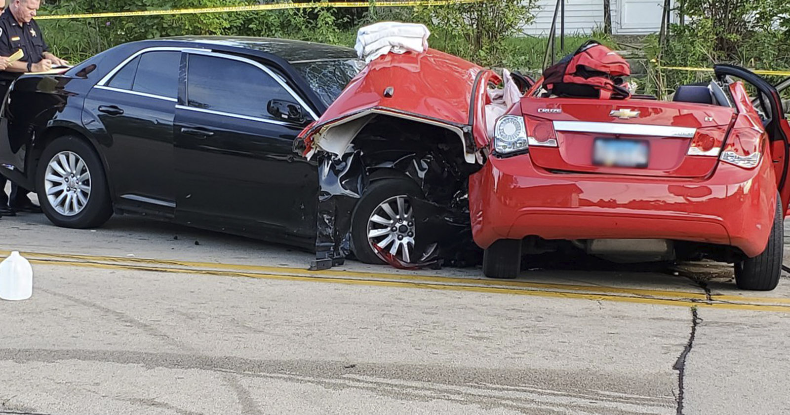 Black car crashing into a red car